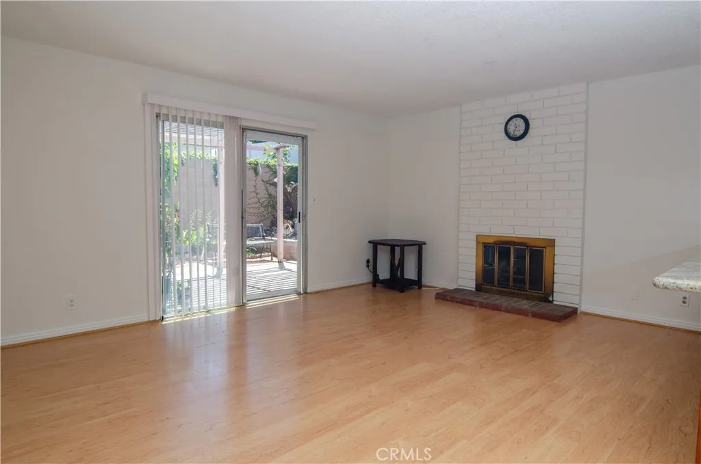 Family room with fireplace - slider door to backyard