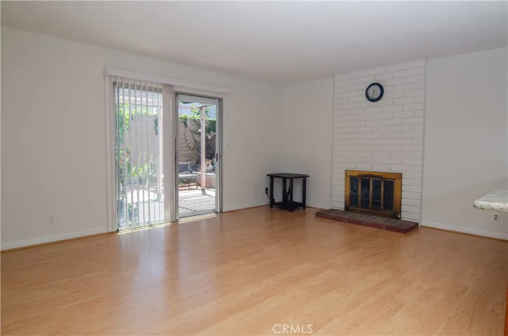 Family room with fireplace - slider door to backyard
