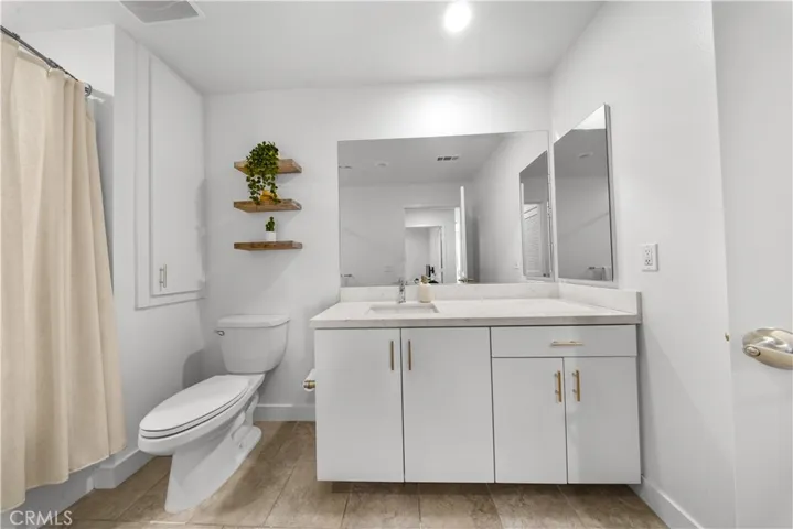 Second bathroom with tub and shower