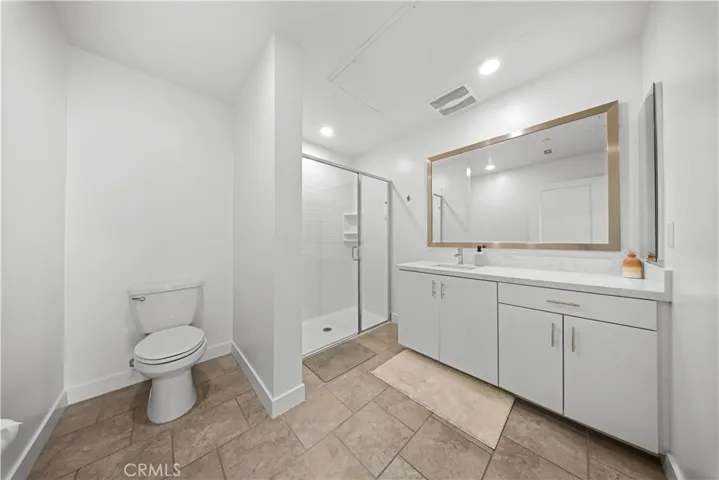 Primary Bathroom, which is bright with lots of under cabinet storage