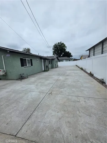 Large yard with parking spaces