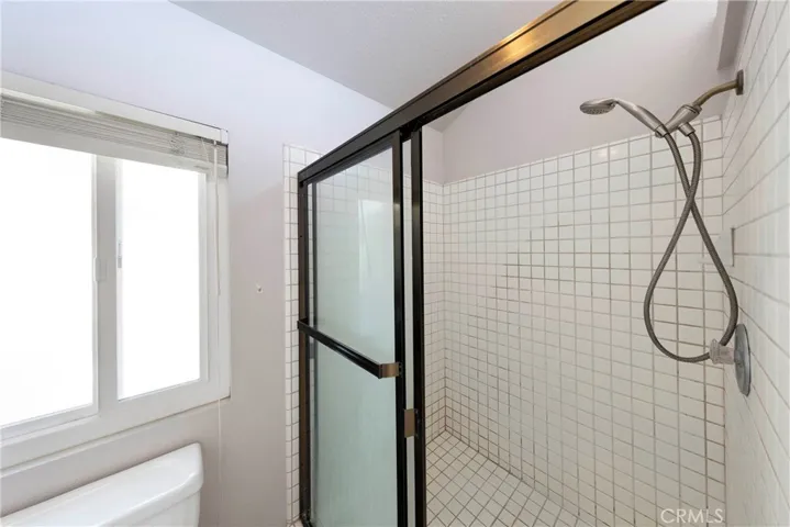 Separated Walk-in shower and private toilet.
