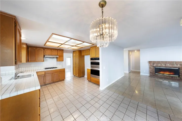 Kitchen is open to breakfast nook space and family room.