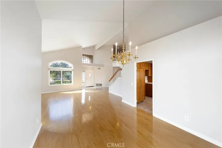 Open floor plan. High ceilings along living room to dining area.
