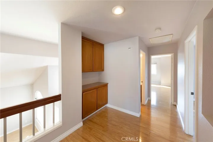 Open second floor leading to bedroom and baths with additional built-in storage throughout.