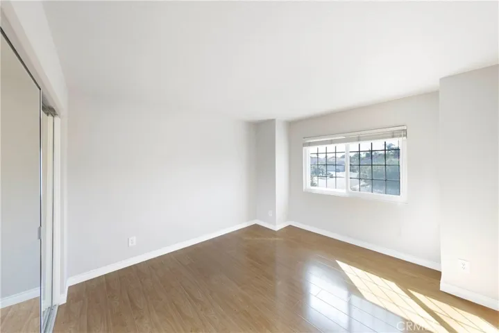 Upstairs secondary bedroom with spacious closet.