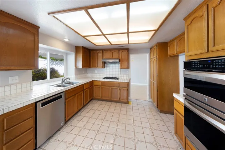 Featuring Brand name appliances, including double oven and dishwasher.