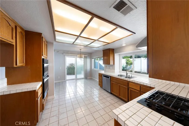 Kitchen with breakfast nook space and access to backyard.