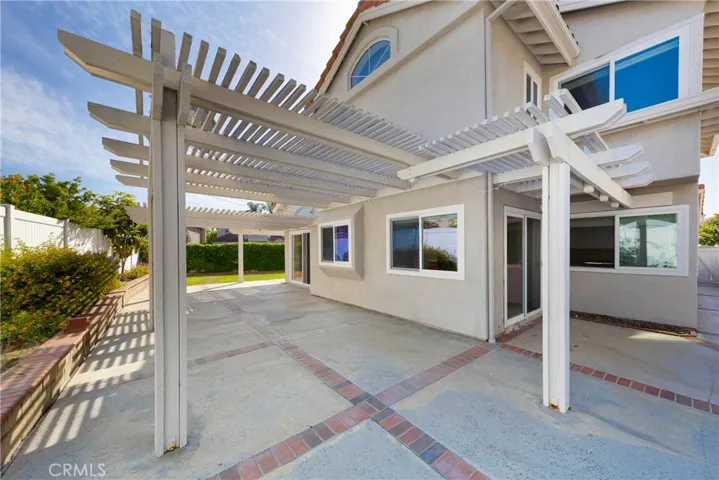 Open backyard with partial covering and easily accessible throughout home.