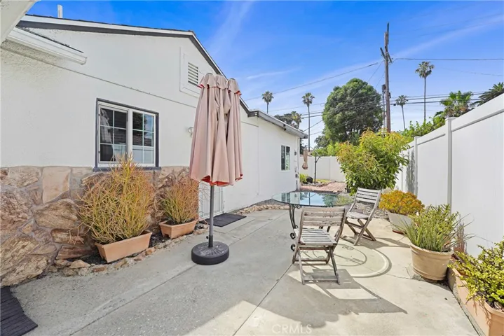 Side yard with kitchen and garage access!