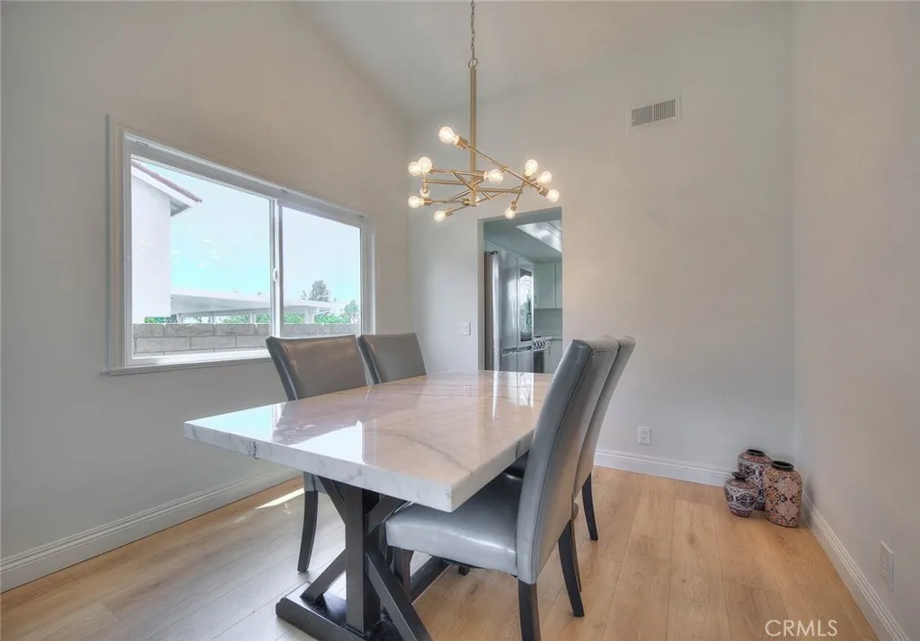 The kitchen is adjacent to the dining room