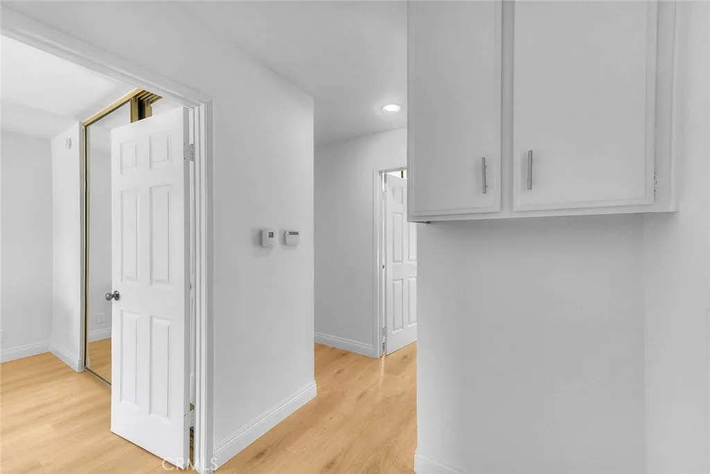 Hallway to secondary bedrooms.  To the left is the double doors to the primary bedroom.