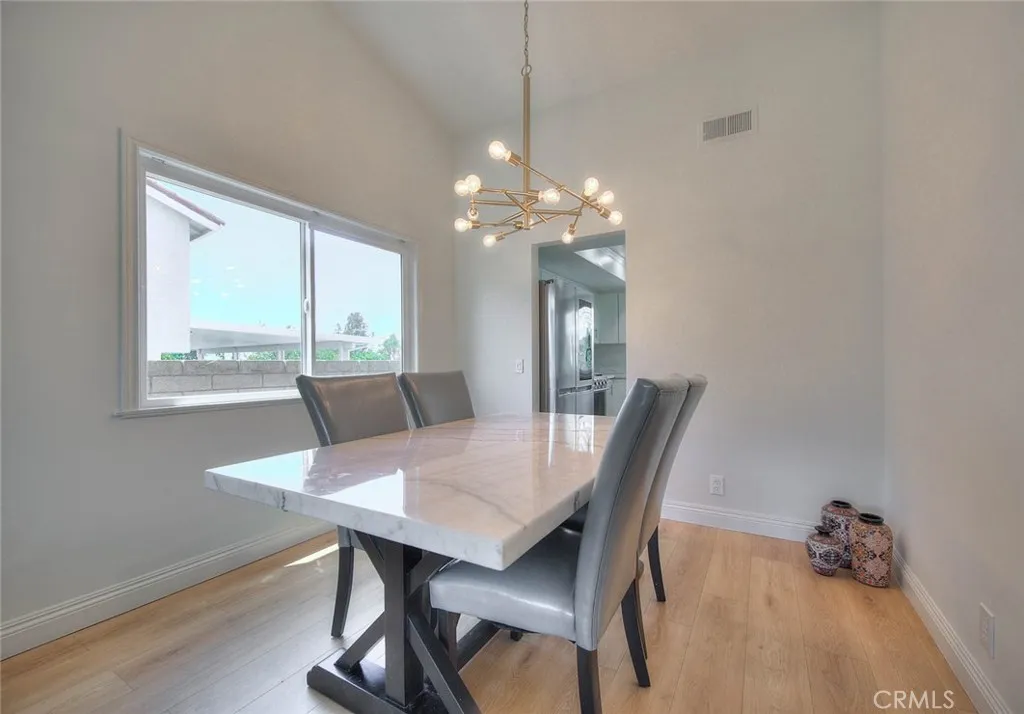 The kitchen is adjacent to the dining room