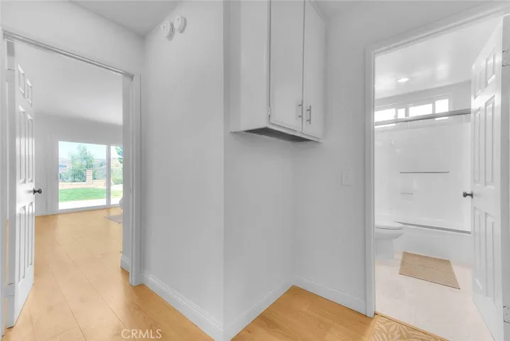 Entry to the primary bedroom and hall bath