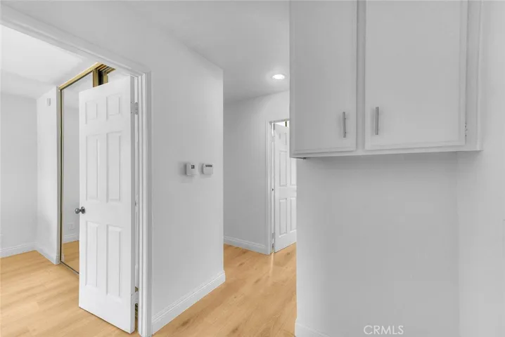 Hallway to secondary bedrooms.  To the left is the double doors to the primary bedroom.