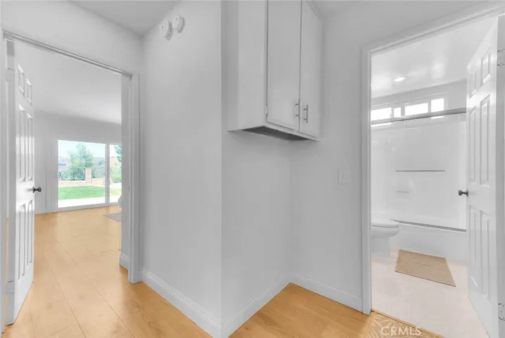 Entry to the primary bedroom and hall bath