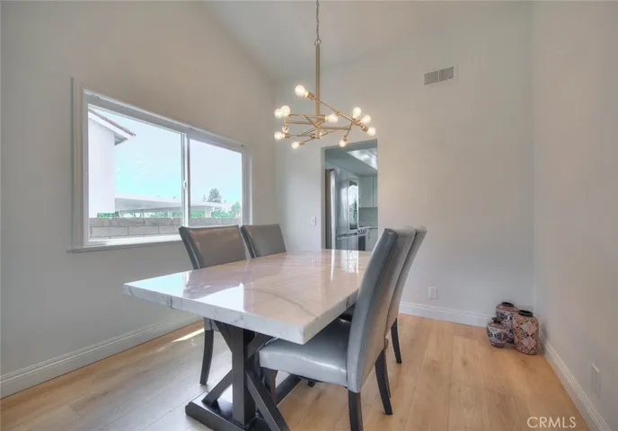 The kitchen is adjacent to the dining room
