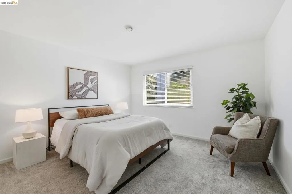Room featuring light gray carpet flooring and white walls