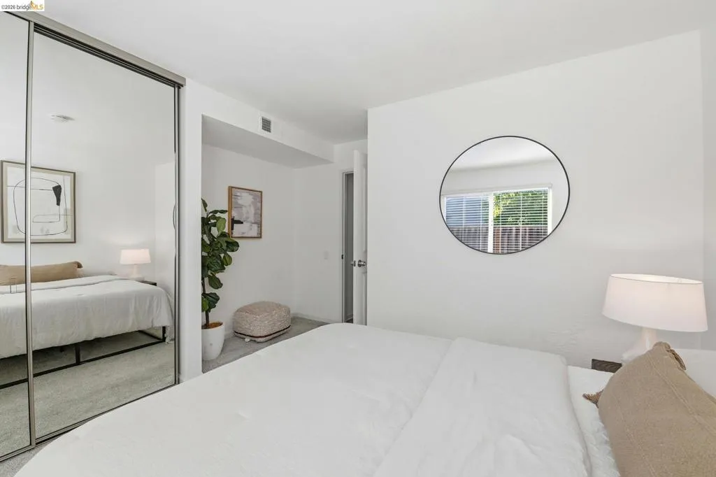 Room with light gray wood-finish flooring and white walls