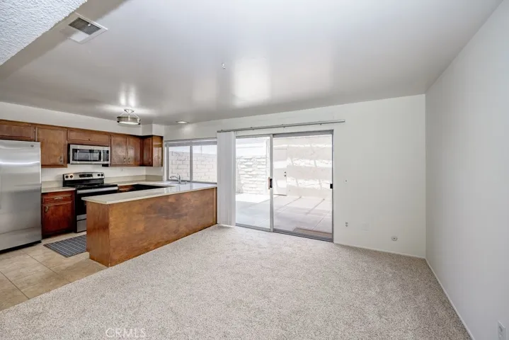 Dining area leads to quart yard and garage
