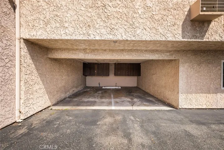 Assigned carport on the right