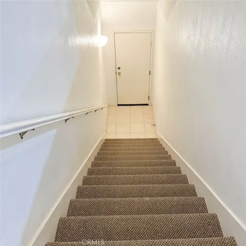 The staircases lead to the attached garage.