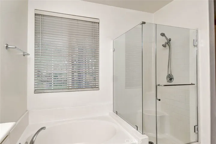 Separate shower with brand new glass enclosure.