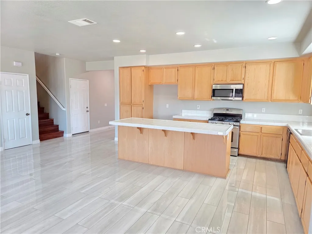 itchen opened to staircase and under staircase storage/coat closet