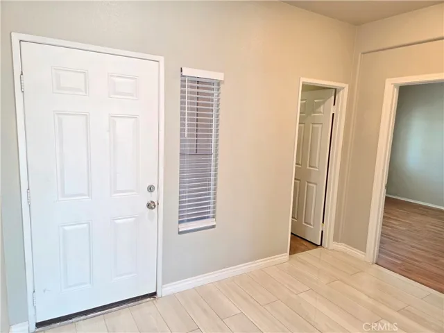 Front door next to bedroom 5 and guest bathroom