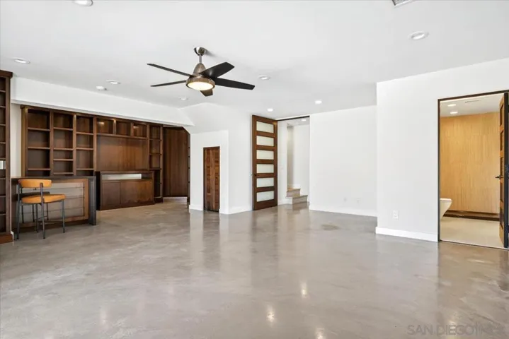 This bonus room on the bottom floor has many possibilities, including a studio apartment or an extension of the entertainment areas of the home.