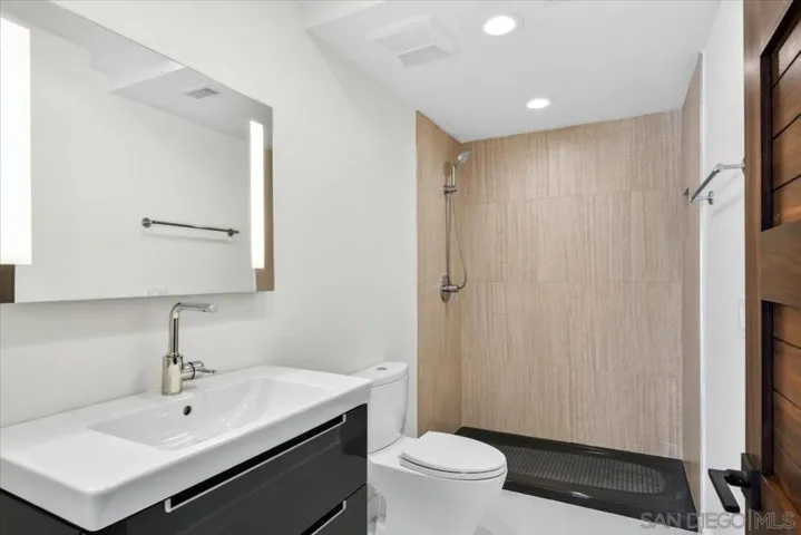 This full bathroom is directly attached to the bonus room.