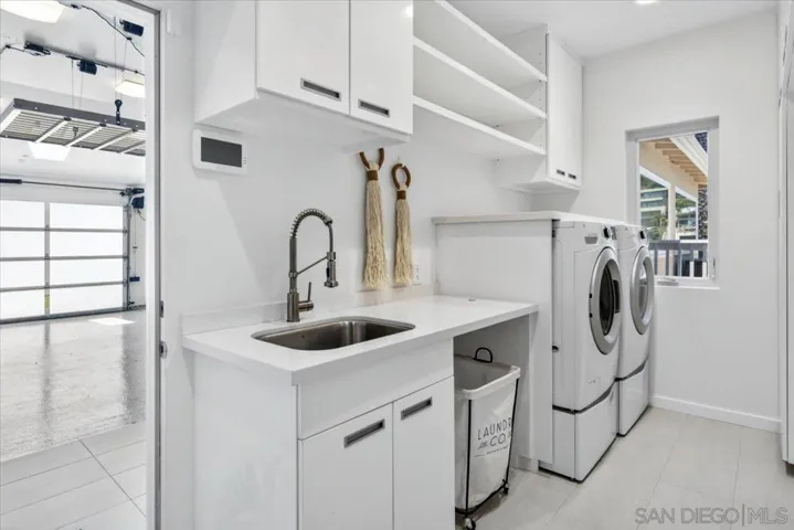Laundry is located just inside the house from the garage.  It has space for an additional refrigerator and/or freezer is desired.