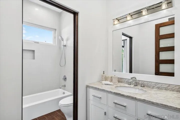 Bathroom attached to Bedroom #4.  Additional exterior door leads to common area.