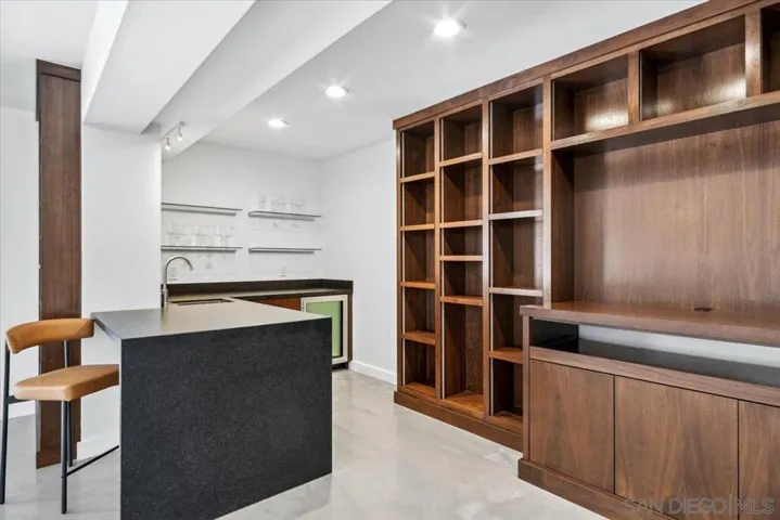 This bonus room on the bottom floor has many possibilities, including a studio apartment or an extension of the entertainment areas of the home.