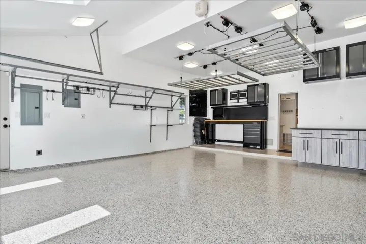 All storage in the garage will convey with the house.  The racks on the ceiling are powered and lower at the touch of a button.