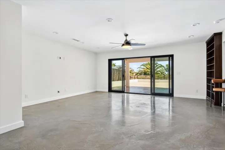 This bonus room on the bottom floor has many possibilities, including a studio apartment or an extension of the entertainment areas of the home.