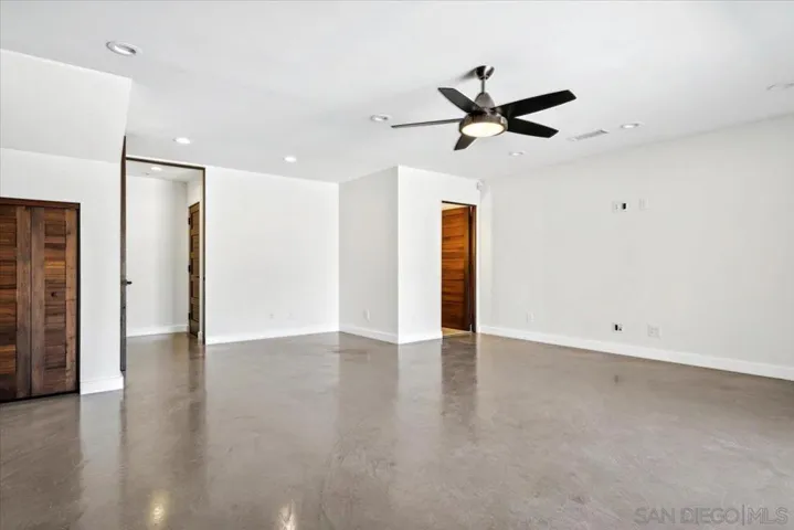 This bonus room on the bottom floor has many possibilities, including a studio apartment or an extension of the entertainment areas of the home.