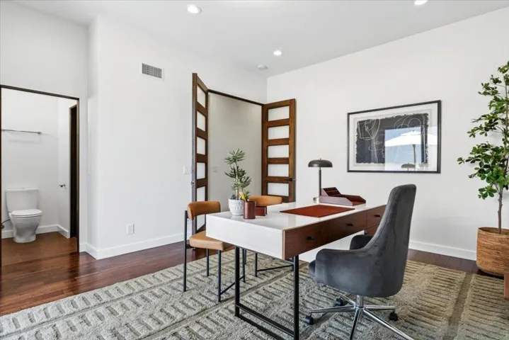 Bedroom #4 can easily be used as a home office.  It has an attached bathroom, which has a separate door to the common areas for guests.