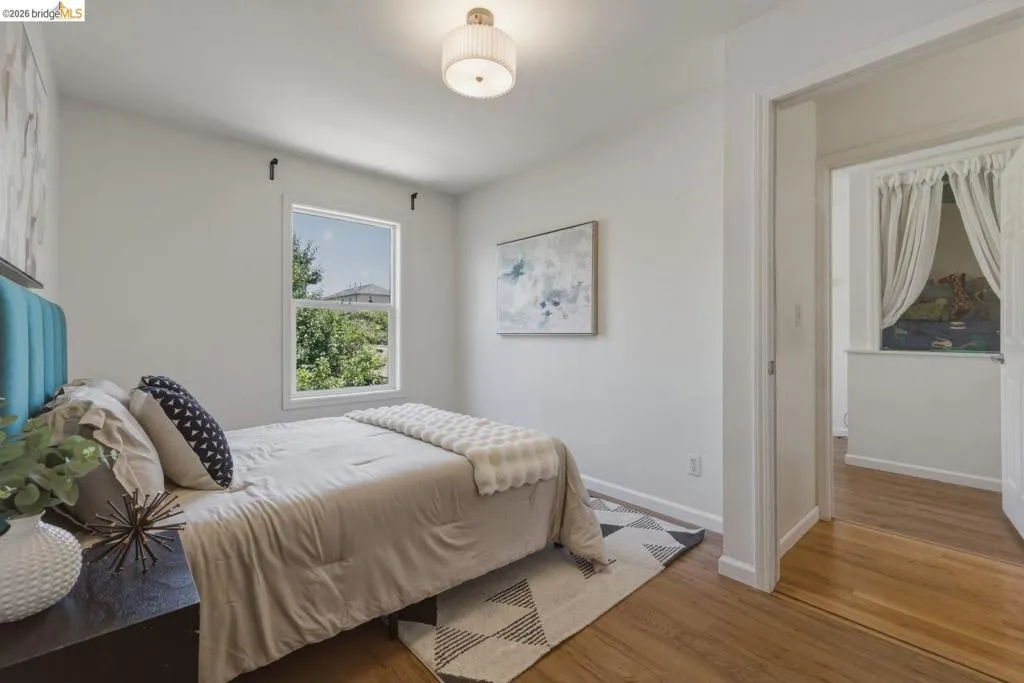 Hardwood-style flooring throughout this bedroom space