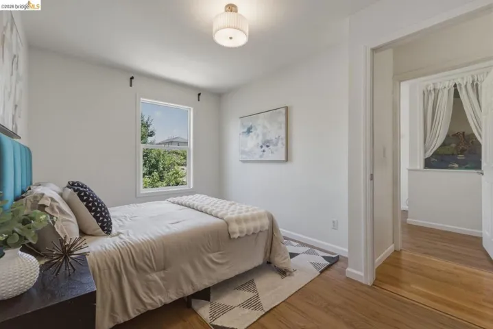 Hardwood-style flooring throughout this bedroom space