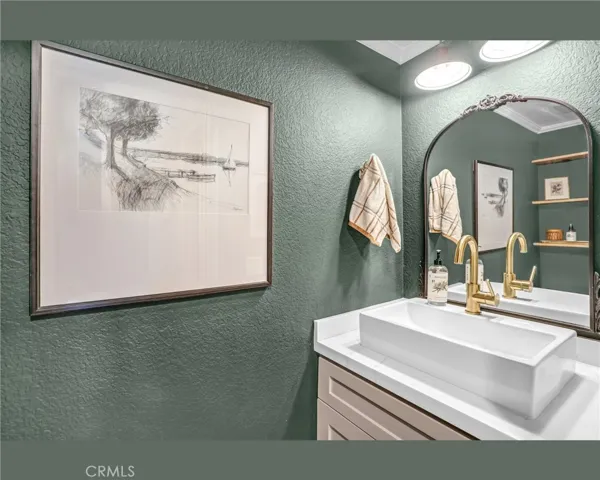 The powder room right off the family room. **