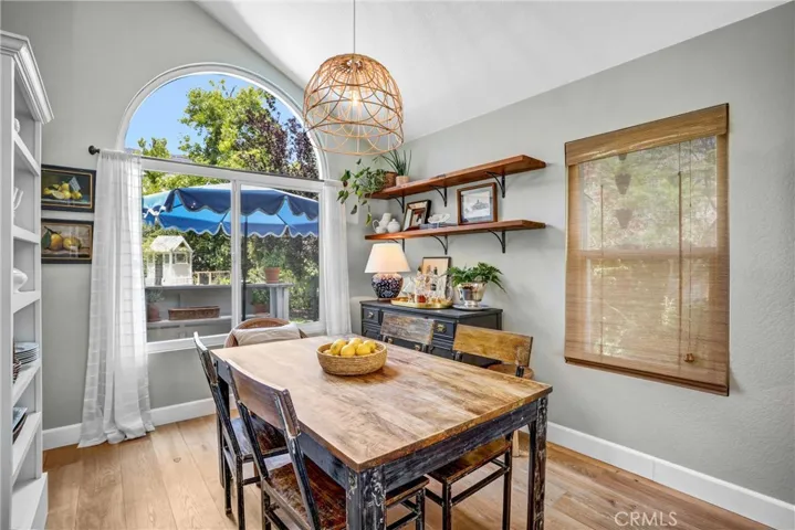 The dining room has a perfectly framed view of the backyard.