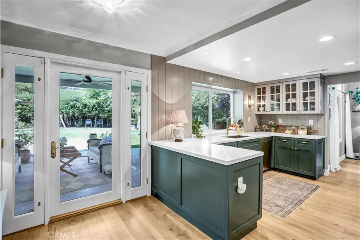 The kitchen is perfecly placed near the backdoor of the vast yard.