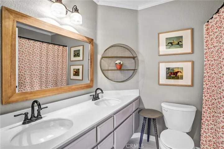 The guest bath upstairs has double sinks.