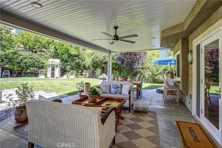 The newer alumawood patio cover allows outdoor dining year round.