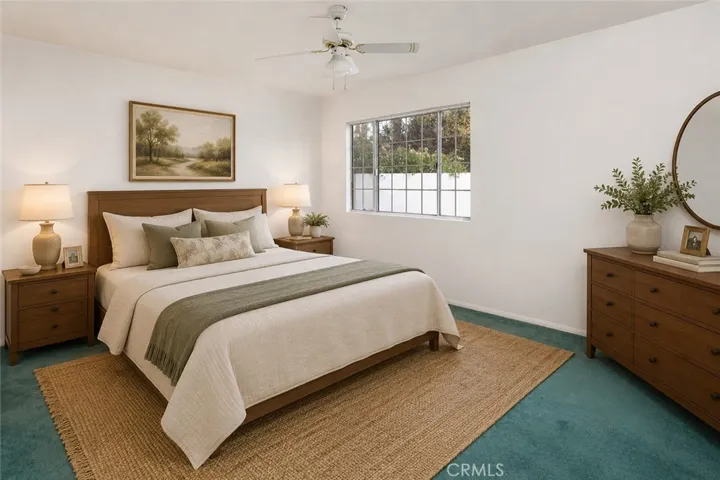 The primary suite includes its own private bath.  Photo is virtually staged.