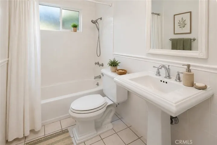 Guest bathroom.  Photo is virtually staged.