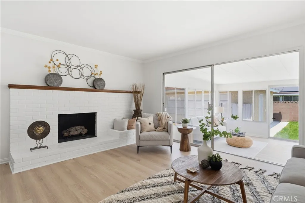Fresh interior paint and a stunning white brick fireplace that serves as the centerpiece of the home.
