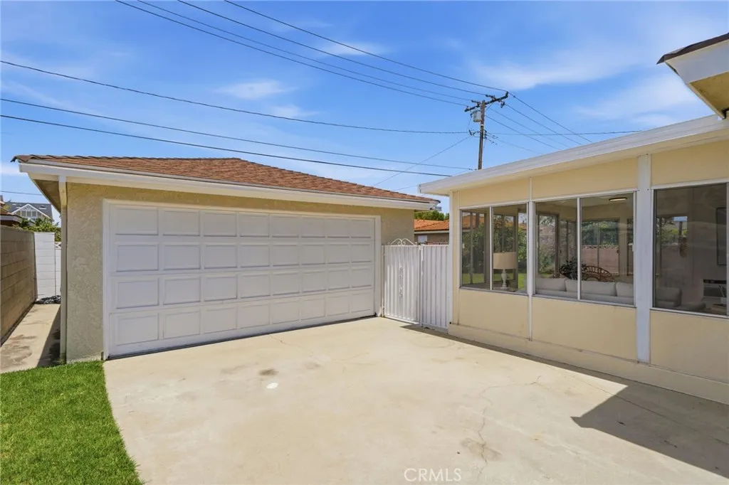 Outside, enjoy the large private backyard, detached two-car garage, and extended driveway with parking for multiple vehicles