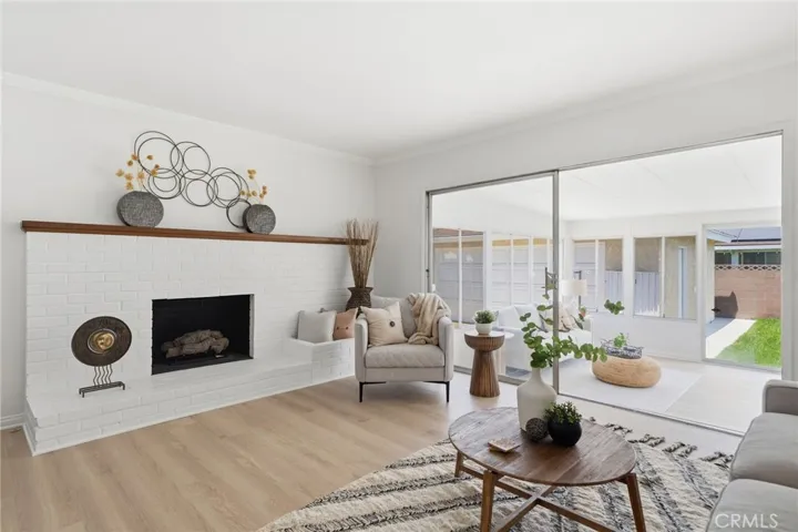 Fresh interior paint and a stunning white brick fireplace that serves as the centerpiece of the home.